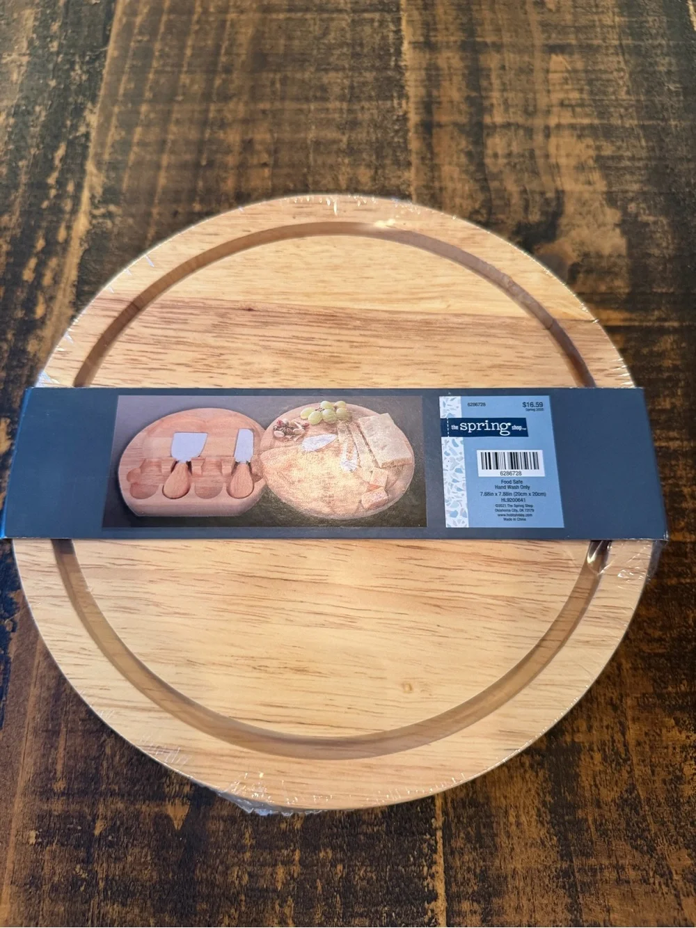 Round Bamboo Serving Board that opens with Utensils inside.